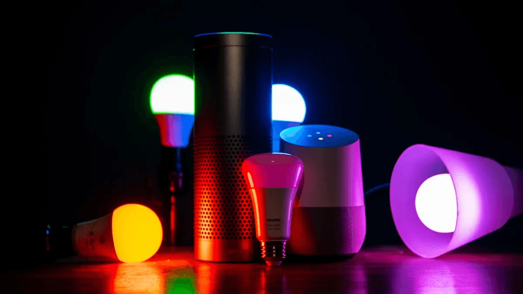 Collection of colorful smart bulbs and voice assistants showcasing smart lighting options